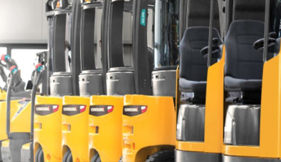 Forklift trucks lined up in a row