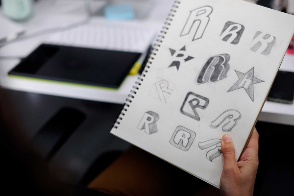 Logo sketches on a notepad