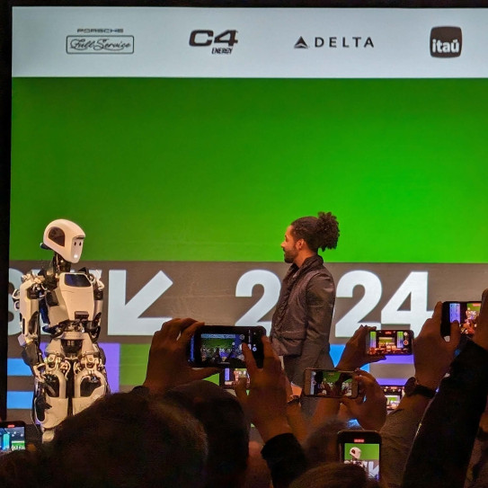 Speaker chatting to a robot at SXSW 2024