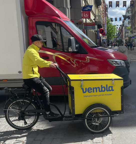 Vembla courier out for delivery on a box bicycle