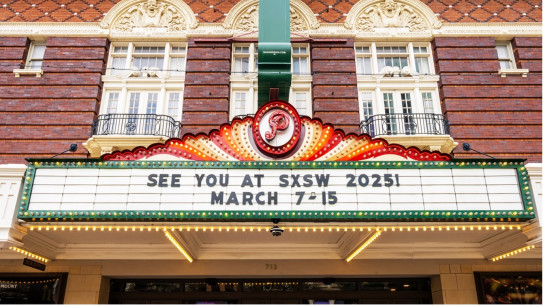 digital panel displaying the message “see you at SXSW 2025! March 7-15th”.  